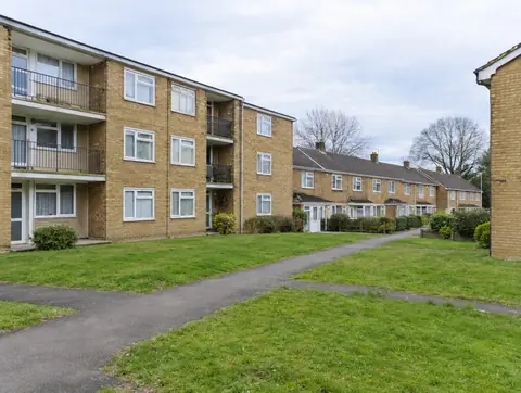 1970s low-rise housing estate of buff brick maisonettes and terraced houses