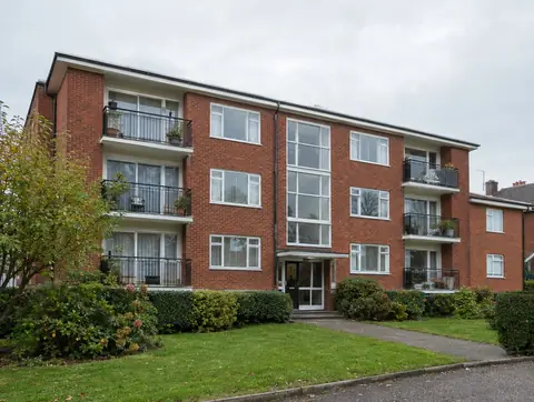 Three-storey 1960s red brick block of flats